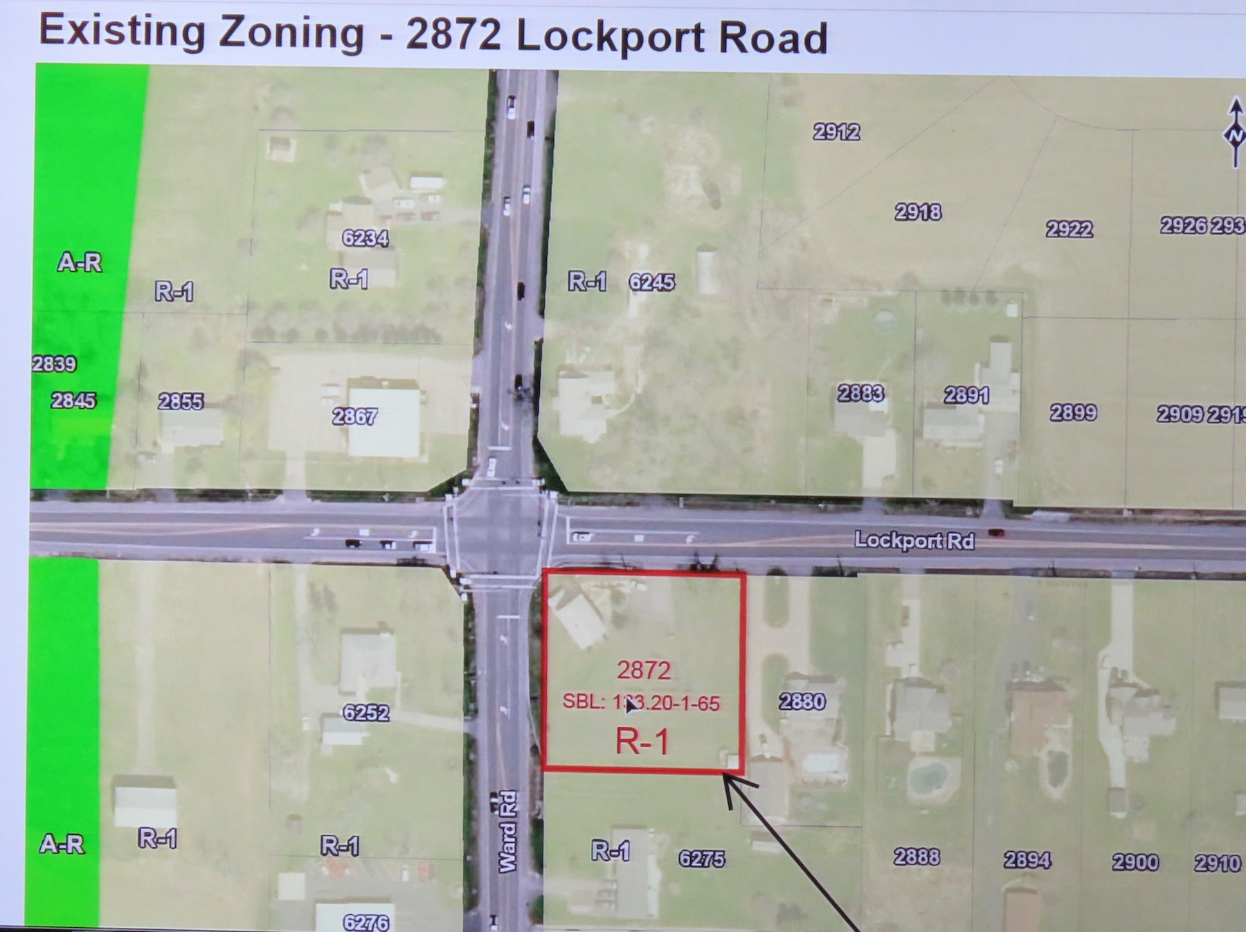 A display from Monday's presentation presenting the rezoning of 2872 Lockport Road. The property was rezoned from R-1 residential to R-C restricted commercial. The area being rezoned is displayed inside the box. (Photo by David Yarger)